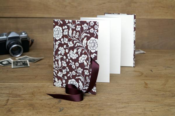 red photo book small with silver bow